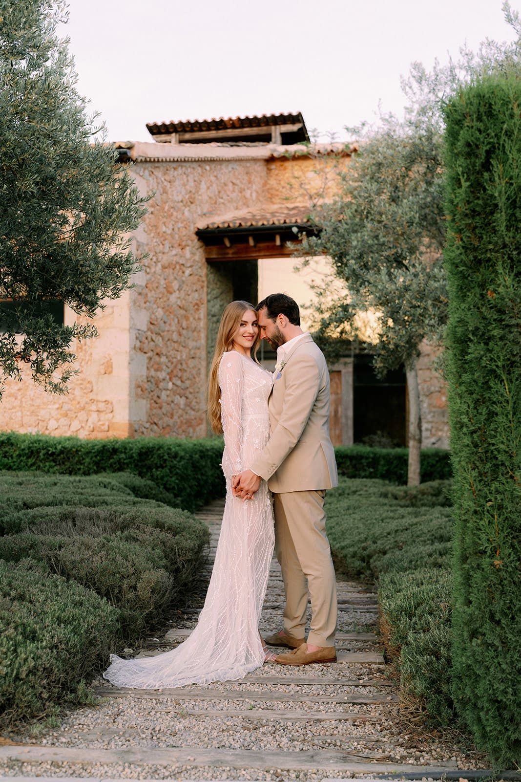 A couple in a garden at a Mallorcan finca